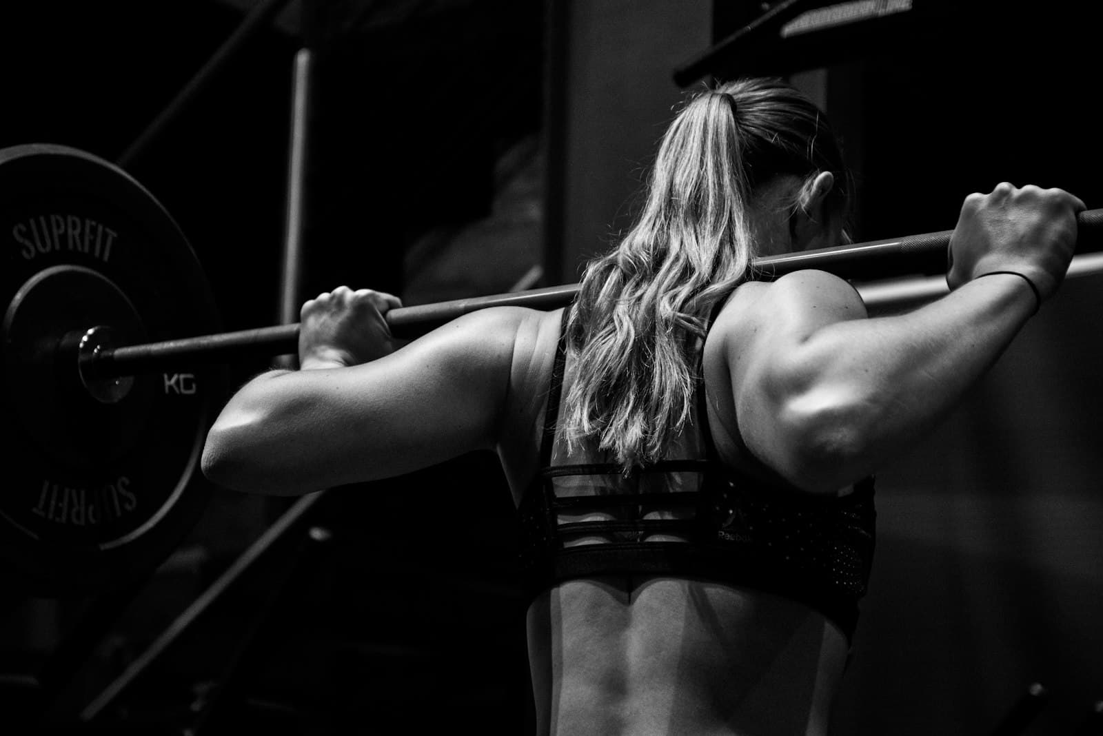 Athlete training in a darkened gym